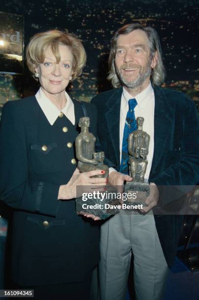 English actress Maggie Smith and Tom Courtenay with their awards at the Evening Standard Drama Awards, London, November 1994. Smith won the Best...