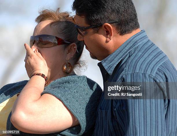 Connie Santana, left, is over come by emoting after see the tree where here friend was killed by the recent tornado in Holly Colorado. Her husband...