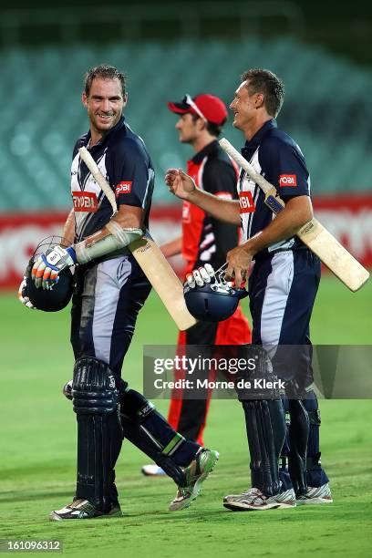 John Hastings and Darren Pattinson of the Bushrangers is leaves the field after the Ryobi One Cup Day match between the South Australian Redbacks and...