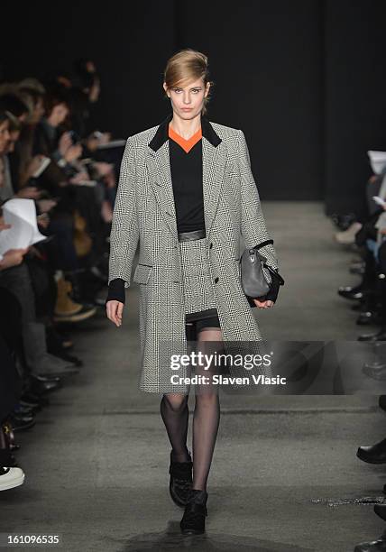 Model walks the runway at the Rag & Bone Women's fall 2013 fashion show during Mercedes-Benz Fashion Week at Skylight Studios at Moynihan Station on...