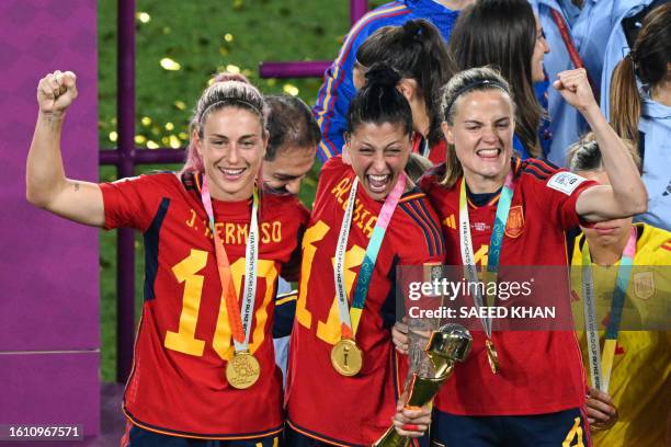 Spain's players celebrate with the trophy after winning the Australia and New Zealand 2023 Women's World Cup final football match between Spain and...