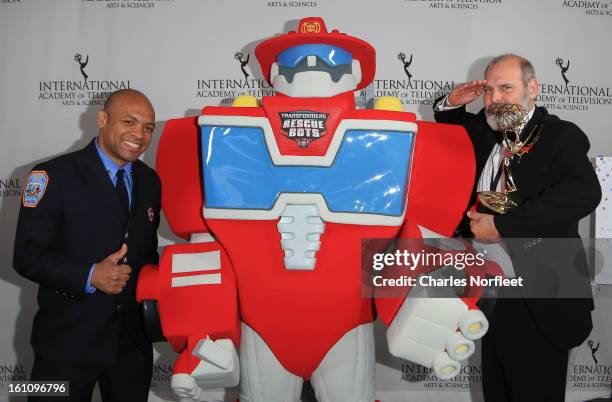 Firefighter Daniel Glover, Transformer Rescue Bot, Heatwave, and British Television Executive Producer Michael Carrington with the Kids: Animation...