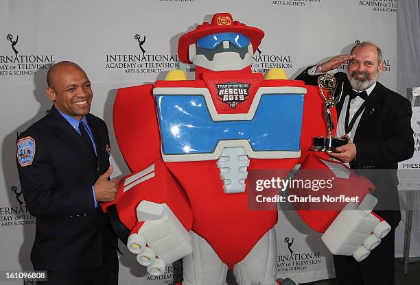 Firefighter Daniel Glover, Transformer Rescue Bot, Heatwave, and British Television Executive Producer Michael Carrington with the Kids: Animation...