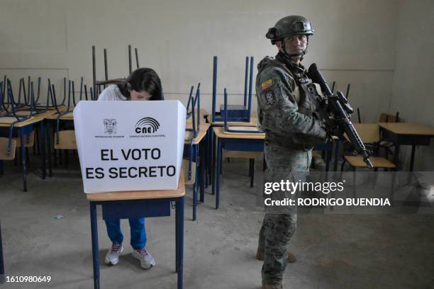 Ecuador's presidential candidate for the Revolucion Ciudadana party, Luisa Gonzalez, votes under heavy security at a polling station in Canuto,...
