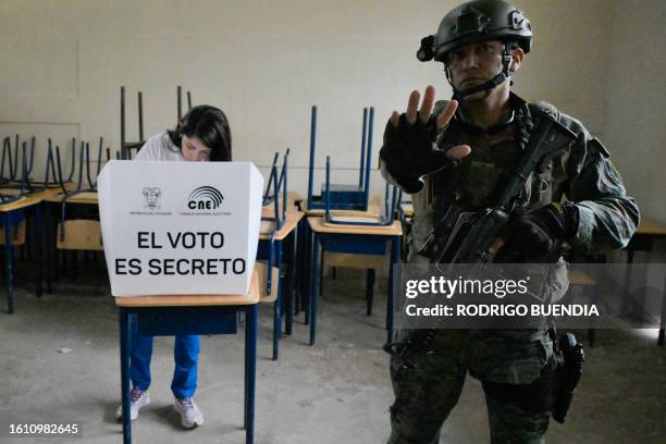 Ecuador's presidential candidate for the Revolucion Ciudadana party, Luisa Gonzalez, votes under heavy security at a polling station in Canuto,...