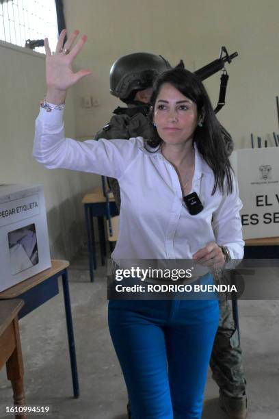 Ecuador's presidential candidate for the Revolucion Ciudadana party, Luisa Gonzalez, waves as she votes at a polling station in Canuto, Manabi...