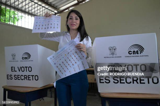 Ecuador's presidential candidate for the Revolucion Ciudadana party, Luisa Gonzalez, votes at a polling station in Canuto, Manabi Province, displays...