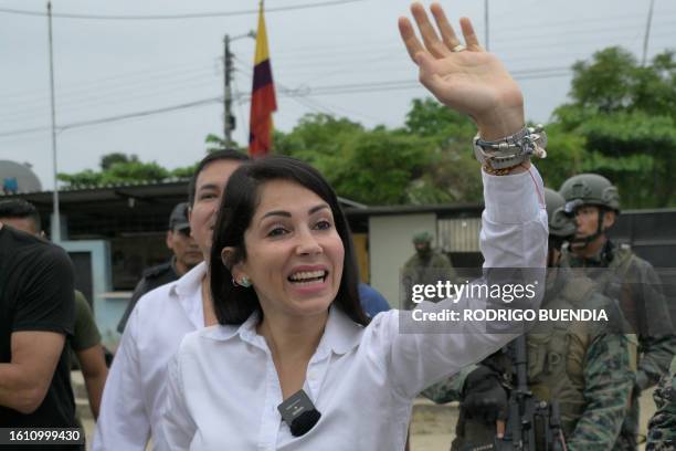 Ecuador's presidential candidate for the Revolucion Ciudadana party, Luisa Gonzalez, waves as she arrives at a polling station in Canuto, Manabi...