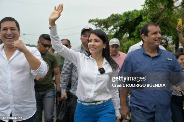 Ecuador's presidential candidate for the Revolucion Ciudadana party, Luisa Gonzalez, waves as she arrives at a polling station in Canuto, Manabi...