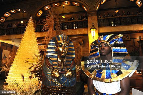 Mario Avent, , right, dressed up as ancient egyptians as part of the decorations for the event. The 23rd Champagne Cascade, held each year at the...