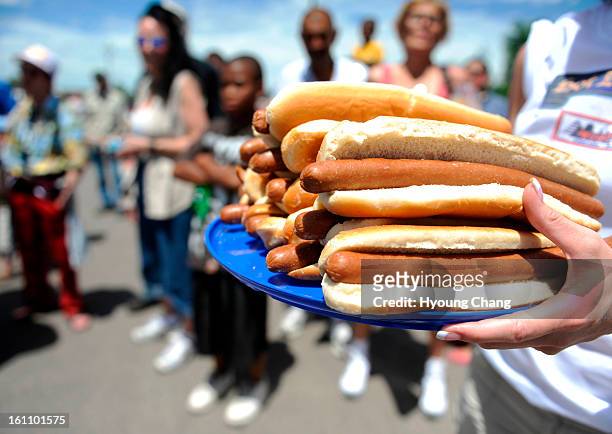 Woody's Chicago Style is holding its 4th Annual FootLong Hot Dog Eating Competition AKA 'Hot Dog Fest' at Brighton on Saturday. Contestants have 10...