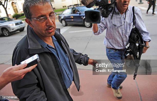 Mohammed Zazi, the father of Najibullah Zazi, waves off reporters as he leaves the FBI's Denver headquarters in downtown Denver. Mohammed was asked...