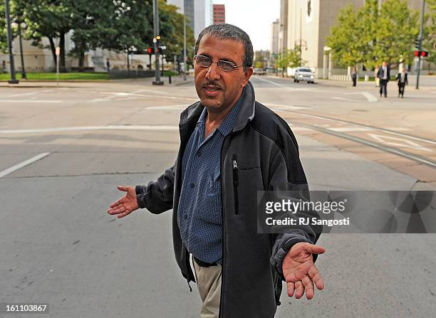 Mohammed Zazi, the father of Najibullah Zazi, waves off reporters as he leaves the FBI's Denver headquarters in downtown Denver. Mohammed was asked...