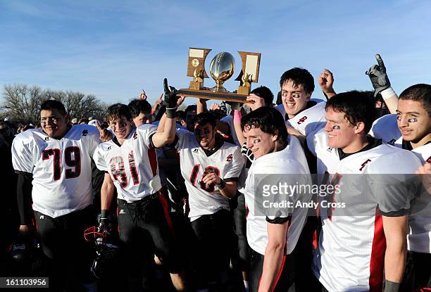 The Burlington Cougars celebrate their Colorado State 1A Championship football over Wray Saturday afternoon, November 27th 2010, at Wray High School....