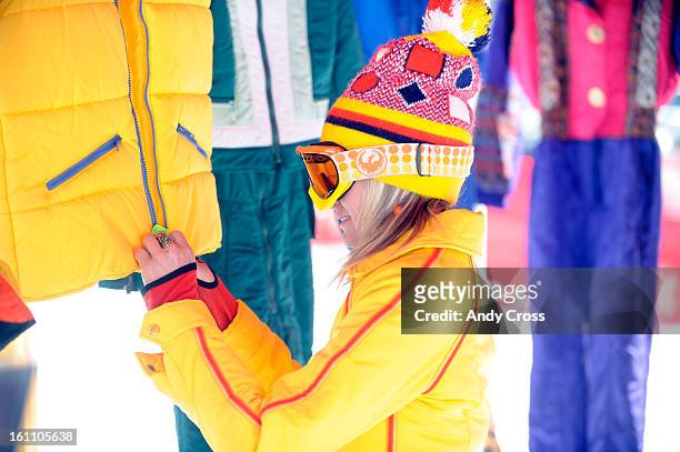 Nysa Rayno, owner of Bleu Star Vintage clothing company in Boulder Colorado, zips up a vest in a booth at Eldora Mountain Resort Saturday afternoon...