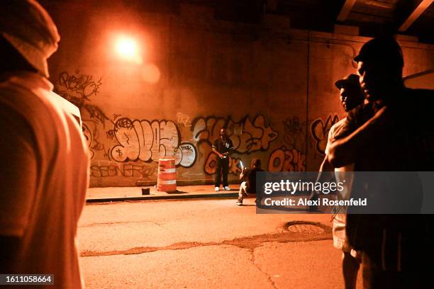 Person takes photos with graffiti under the bridge during the fiftieth anniversary of Hip Hop block party near 1520 Sedgwick Ave on August 12, 2023...