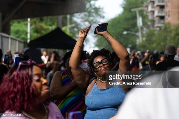 Woman dances at the fiftieth anniversary of Hip Hop block party near 1520 Sedgwick Ave on August 12, 2023 in The Bronx borough of New York City. On...