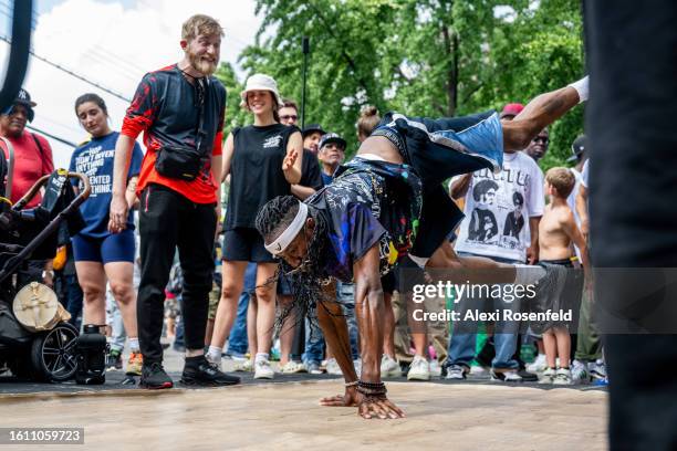 People breakdance at the fiftieth anniversary of Hip Hop block party near 1520 Sedgwick Ave on August 12, 2023 in The Bronx borough of New York City....