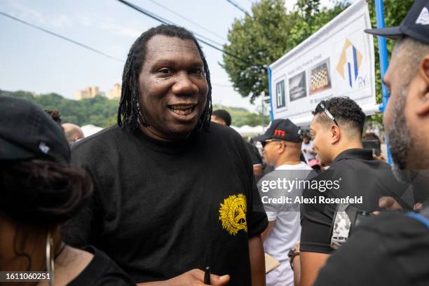 One interacts with people at the fiftieth anniversary of Hip Hop block party near 1520 Sedgwick Ave on August 12, 2023 in The Bronx borough of New...