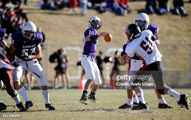 Wray Eagles QB, Brett Vlasin, looks for an open man against the Burlington Cougars during the Colorado State 1A Championship football game Saturday...