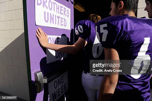 Wray High School football players, enter their locker room before taking on the Burlington Cougars at the Colorado State 1A Championship football...