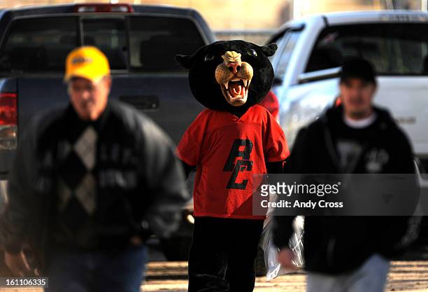 The Burlington mascot, the "Cougar" lurks behind a couple of fans in the parking lot at Wray High School just before the Cougars took on the Wray...