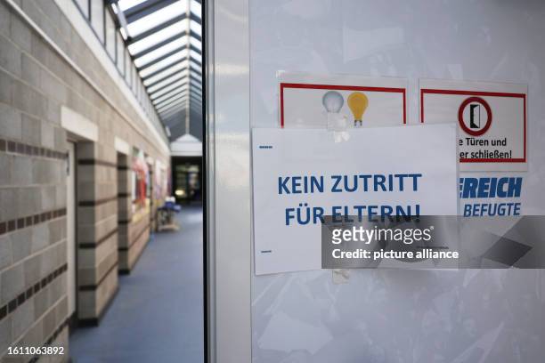 August 2023, Berlin: Regionalliga women: Hertha BSC - Union Berlin. A sign reading "No admission for parents" is seen outside the locker rooms at...