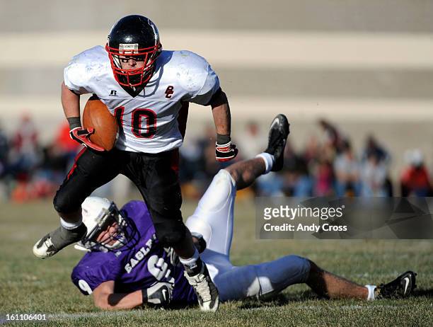Burlington RB, Colin Eberhart, left, gets past Wray Eagles defender, Derek Schulz, during the Colorado State 1A Championship football game Saturday...