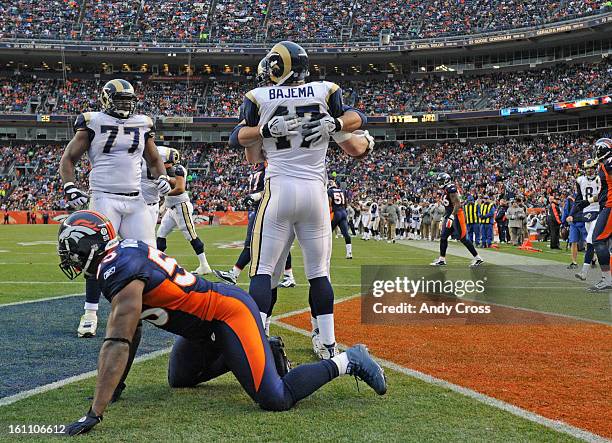 Denver Broncos defender D.J. Williams picks himself off the ground after the St. Louis Rams' Billy Bajema scores his second touchdown of the second...