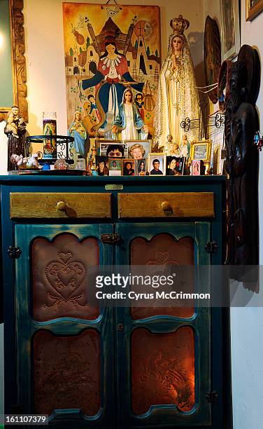 The home of artist Judy Miranda on Monday, April 12, 2010 . Miranda lives in Adams County. Altar space and cabinet. Cyrus McCrimmon, The Denver Post