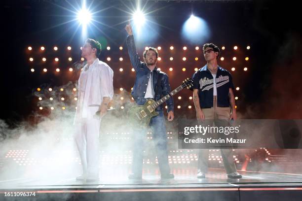 Nick Jonas, Kevin Jonas, and Joe Jonas perform onstage during Jonas Brothers "Five Albums, One Night" Tour Opening Night at Yankee Stadium on August...