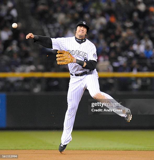 Colorado Rockies short stop Troy Tulowitzki throws out Philadelphia Phillies' center fielder Shane Victorino for the first out of the top of the...