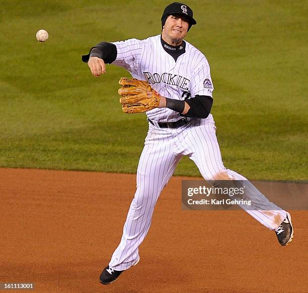 Colorado Rockies short stop Troy Tulowitzki throws out Philadelphia Phillies' center fielder Shane Victorino for the first out of the top of the...