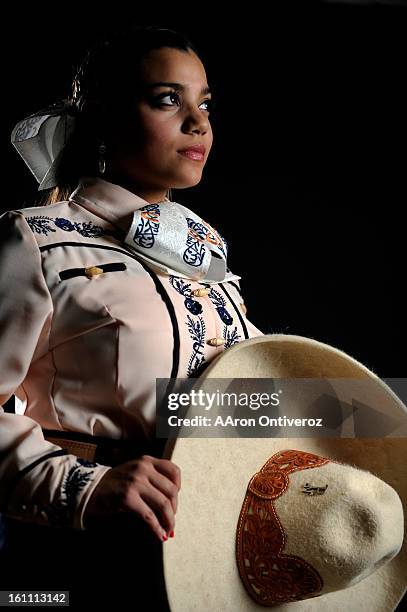 Gaby Padilla poses for a portrait during the Mexican Rodeo Extravaganza at the Denver Coliseum. The rodeo combines Mexican culture, traditions and...