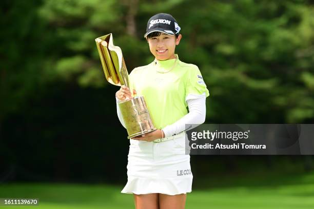 Nana Suganuma of Japan poses with the trophy after winning the tournament following the final round of NEC Karuizawa72 Golf Tournament at Karuizawa...