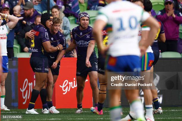 Harry Grant of the Storm celebrates scoring a try during the round 24 NRL match between Melbourne Storm and Canberra Raiders at AAMI Park on August...