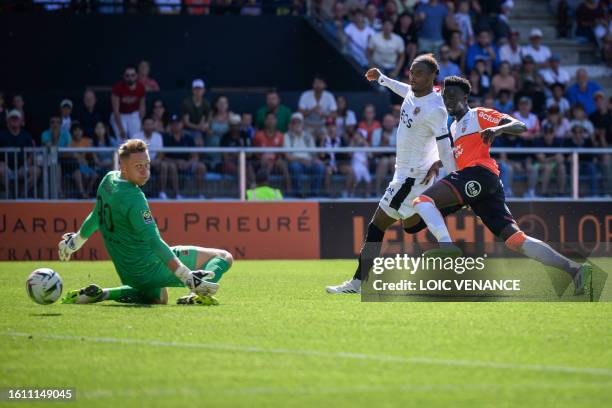 Lorient's French forward Sirine Doucoure shoots to score the first goal for his team during the French L1 football match between FC Lorient and OGC...