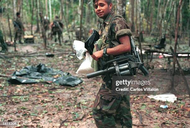 Colombian special forces soldier guards a captured FARC camp August 25, 2001 in Guaviare, Colombia. The army has been continuing a new offensive...