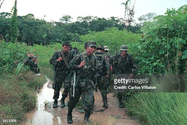 Colombian special forces soldiers patrol the jungles of El Guaviare during a counter guerrilla operation August 25, 2001 in Guaviare, Colombia. The...
