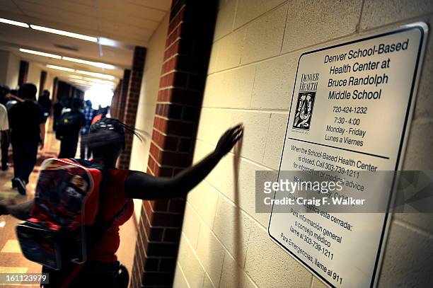 Students pass through the hallway outside the Denver School-Based Health Center at Bruce Randolph Middle School, Denver, CO. Bruce Randolph is the...