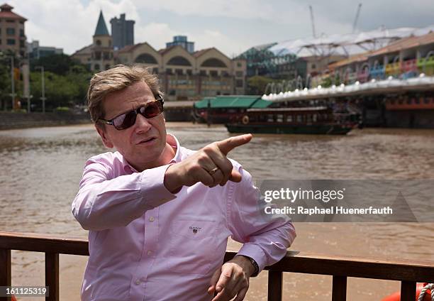 German Foreign Minister Guido Westerwelle takes a boat tour on the Singapore River on February 9, 2013 in Singapore. Westerwelle is in Singapore to...