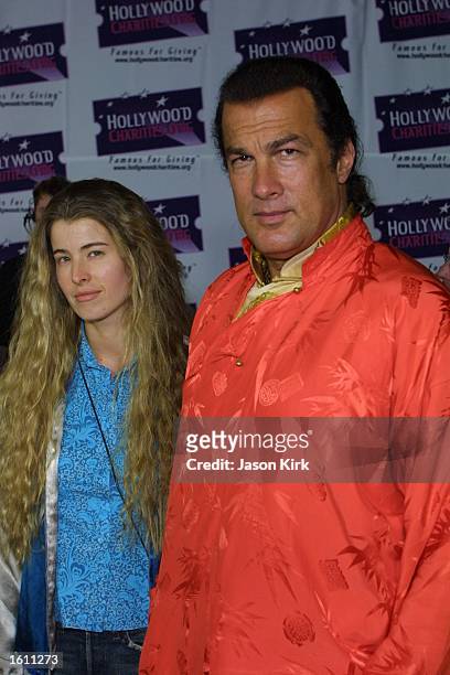 Actor Steven Seagal and wife Adrienne La Russa arrive at the Hard Rock Charity Jam for Hollywoodcharities.org August 29, 2001 in Universal City, CA.