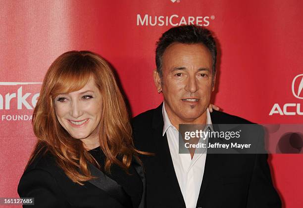 Musicians/singers Bruce Springsteen and Patti Scialfa arrive at the 2013 MusiCares Person Of The Year Honoring Bruce Springsteen at Los Angeles...