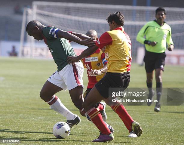 Arnab Mondal of East Bengal is trying to hold Odafa of Mohun Bagan from back during the derby match of I-League at Yuba Bharati Krirangan, Salt Lake...