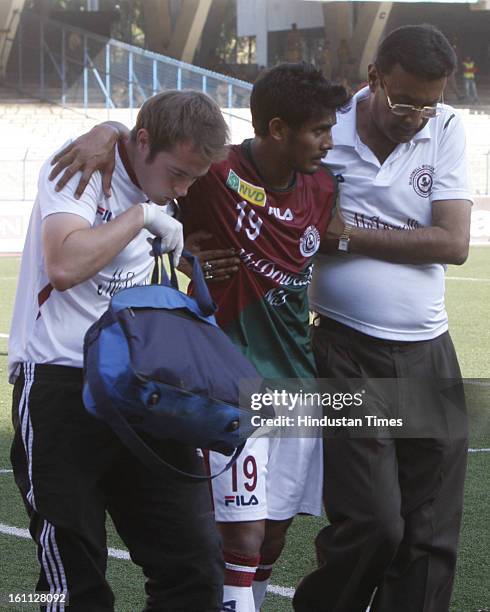 Rahim Nabi of Mohun Bagan is being taken out of the ground after the injury during the derby match of I-League against east Bengal at Yuba Bharati...