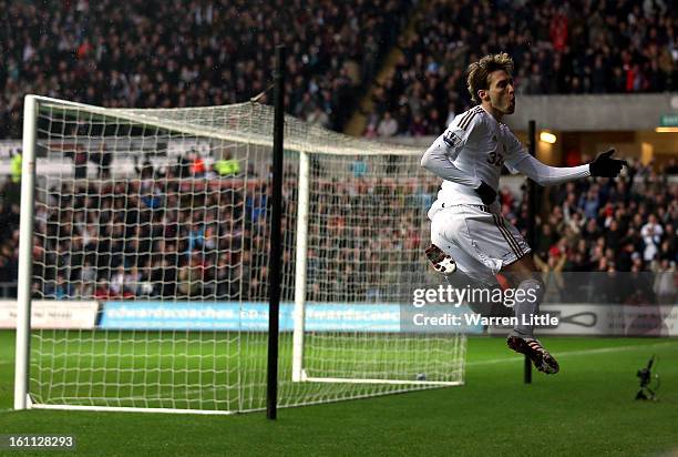 Michu of Swansea celebrates scoring the opening goal during the Premier League match between Swansea City and Queens Park Rangers at Liberty Stadium...