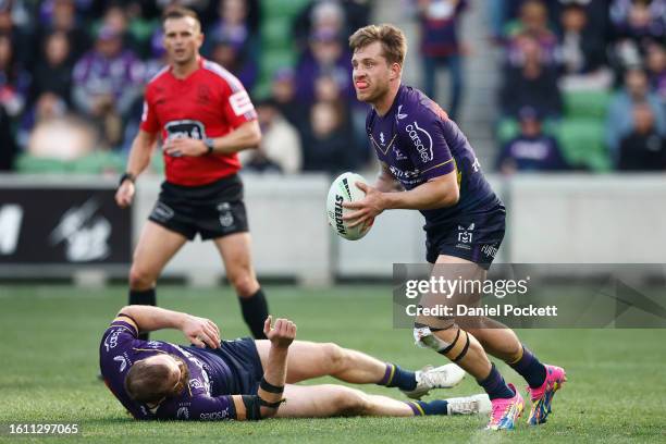 Cameron Munster of the Storm looks to pass the ball during the round 24 NRL match between Melbourne Storm and Canberra Raiders at AAMI Park on August...