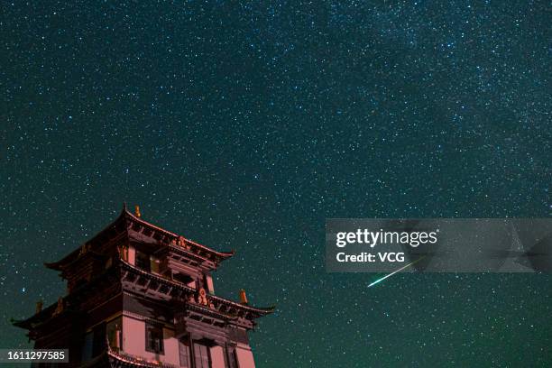 Meteor streaks across the sky during the Perseid meteor shower on August 13, 2023 in Golog Tibetan Autonomous Prefecture, Qinghai Province of China.