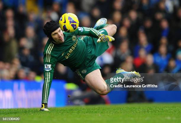 Petr Cech of Chelsea dives to make a save during the Barclays Premier League match between Chelsea and Wigan Athletic at Stamford Bridge on February...