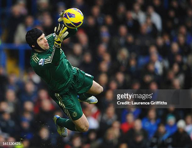 Petr Cech of Chelsea dives to make a save during the Barclays Premier League match between Chelsea and Wigan Athletic at Stamford Bridge on February...